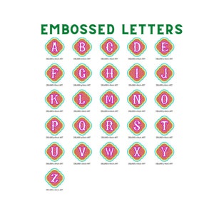 May include: Embossed alphabet letters in a pink, turquoise, and yellow color scheme. Each letter is surrounded by a decorative frame.