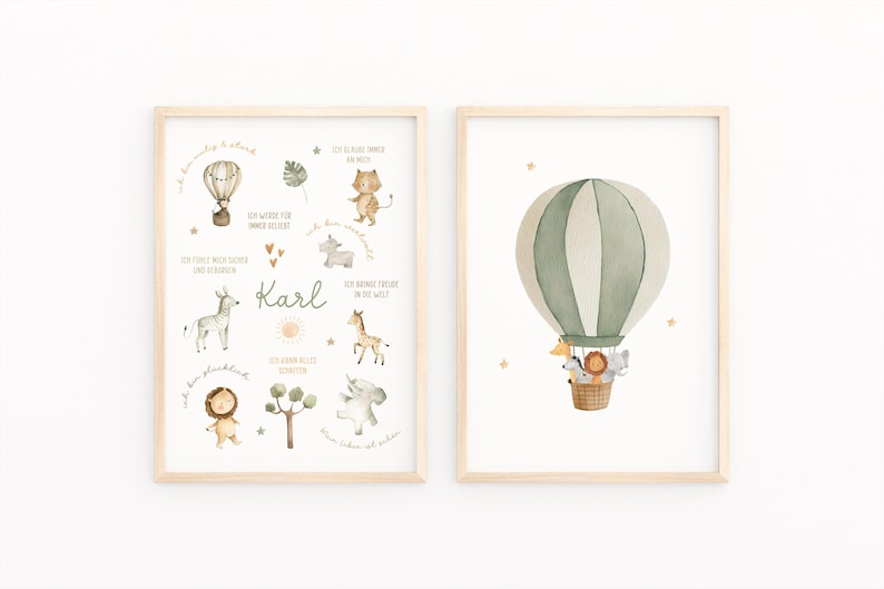 May include: Two framed watercolor prints. One features a hot air balloon with animals in a basket. The other has illustrations of animals, a hot air balloon, and the name "Karl". The prints have a light wood frame.
