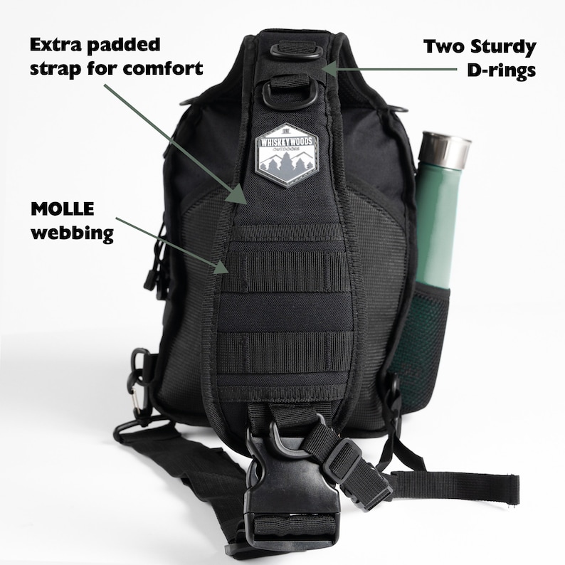May include: Black tactical sling bag with adjustable padded strap, MOLLE webbing, and two D-rings. The bag has a Whiskey Woods logo patch and a side pocket.