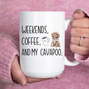 May include: White ceramic coffee mug with black text that reads "Weekends, Coffee, and my Cavapoo." A cartoon image of a cup of coffee and a brown and white cavapoo dog are also on the mug.