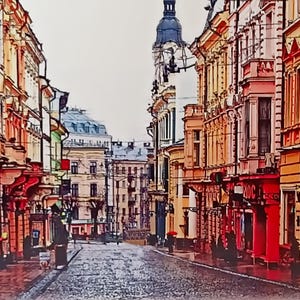 May include: A narrow, cobblestone street lined with colorful, historic buildings in a European city. The buildings have ornate details and are painted in shades of yellow, orange, and red. The street is empty except for a few people walking in the distance.