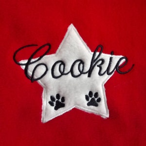 Dog cuddle pillow embroidered with name and a star rot