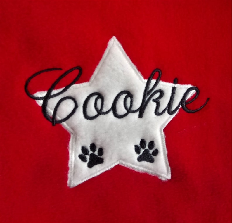 Dog cuddle pillow embroidered with name and a star rot