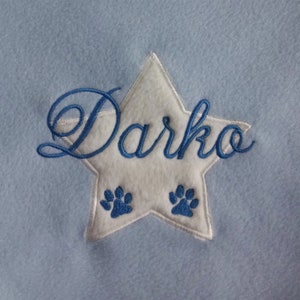 Dog cuddle pillow embroidered with name and a star hellblau