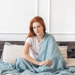 Women holding a weighted blanket