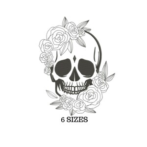 May include: Black and white line art embroidery design of a skull with flowers. The skull has a diamond on its forehead. The text "6 SIZES" is below the image.