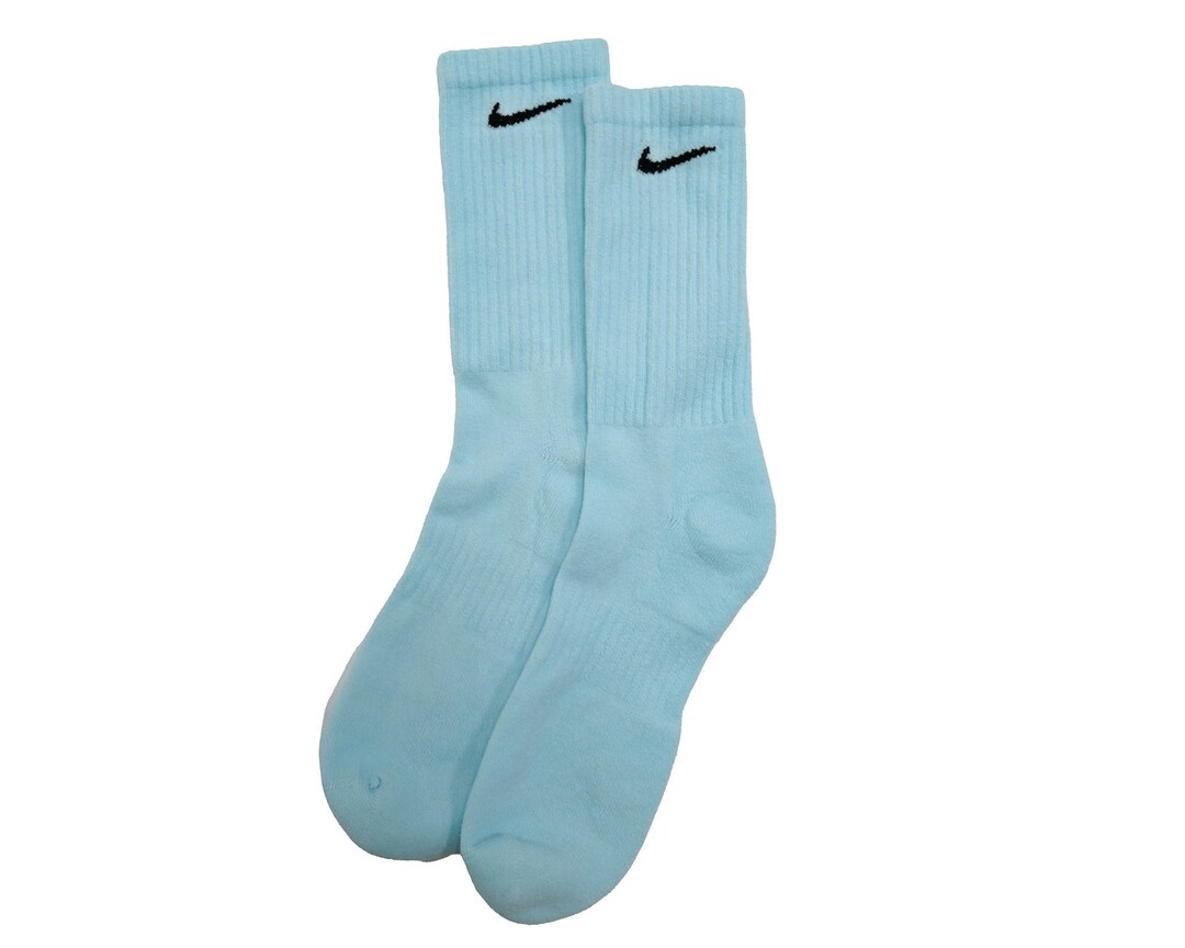 white nike socks with blue swoosh