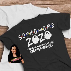 May include: Black t-shirt with white text that reads "Sophmore 2020" with a stylized face mask graphic. The text continues with "The one where we get quarantined".