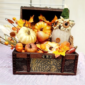 Owl in Treasure Chest Filled with Fall Pumpkins, Leaves and Foliage