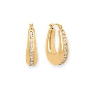 May include: A pair of gold-colored hoop earrings. Each earring has a rounded, teardrop shape with a row of small, clear gemstones along one side. The earrings are set against a white background.