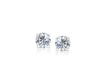 May include: A pair of sparkling, round-cut diamond stud earrings. Each earring features a brilliant, clear gemstone set in a silver or white gold setting. The earrings are displayed against a white background, highlighting their sparkle and clarity.