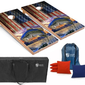 May include: A set of two wooden cornhole boards with a patriotic American flag design and a largemouth bass jumping out of the water. The set includes a black carrying bag, eight bean bags, four red and four blue.