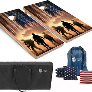 May include: Two wooden cornhole boards with an American flag and silhouette of soldiers against a sunset background. The boards come with a blue carrying bag, 8 bean bags, and the text "Tailgating Pros".