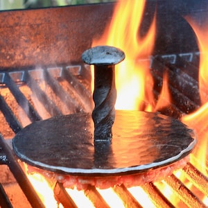 Jumbo hamburger press, with railroad spike