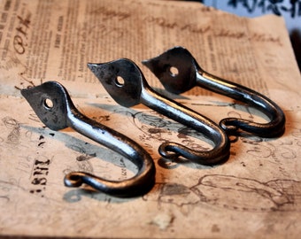 Set of three, hand forged wall hooks, with tulip bulb final