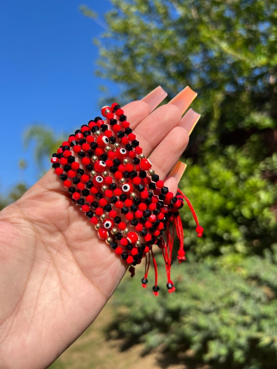 Red and black evil eye best sale bracelet