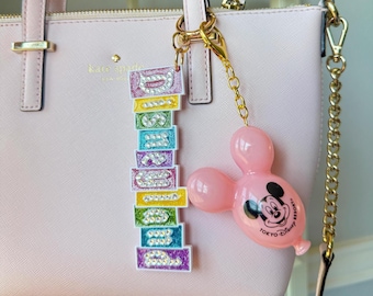 Llavero con dije para bolso de globo de Disney