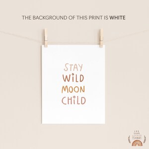 May include: A printable art print with the text "Stay Wild Moon Child" in a modern, minimalist style with a white background. The text is in a brown, orange, and pink color palette.