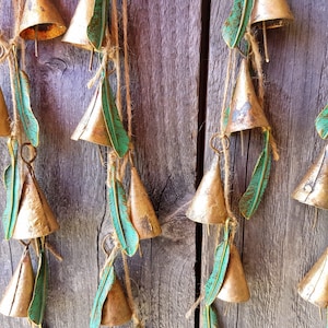 Windchime with 6 cow bells and brass green patina feather charms, rustic vintage bronze gold hanging wall decor, suncatcher, door hanger