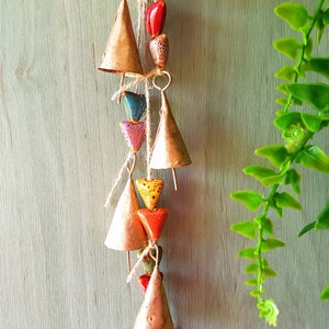 Windchime with cattle bells and ceramic heart shaped beads, Hanging wall art, bells on a string, carillon, mobile, brass bell, jingle bells