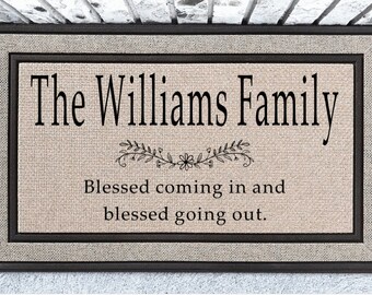 May include: A brown doormat with a beige background and black text that reads "The Williams Family Blessed coming in and blessed going out."
