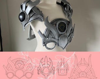 May include: A silver-colored chest and shoulder armor set featuring curved, flame-like plates and a central circular emblem with a sunburst design. Below the armor, a pink graphic displays four distinct line-art patterns labeled PDF PATTERN.