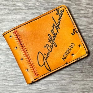 Cartera plegable de cuero con forma de guante de béisbol de Jim "Catfish" Hunter