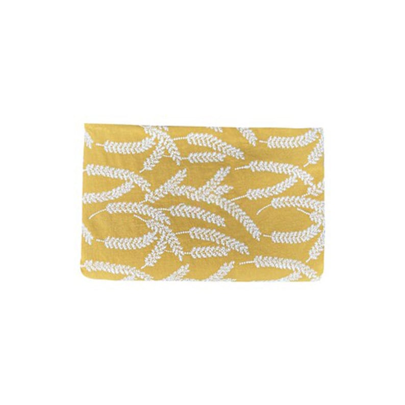 May include: A yellow fabric with a white wheat pattern.