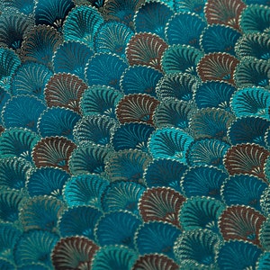 May include: Teal fabric with a repeating pattern of stylized fans in shades of brown, teal, and gold.
