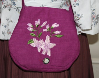 Small shoulder bag embroidered with playful embroidery made of berry-colored linen