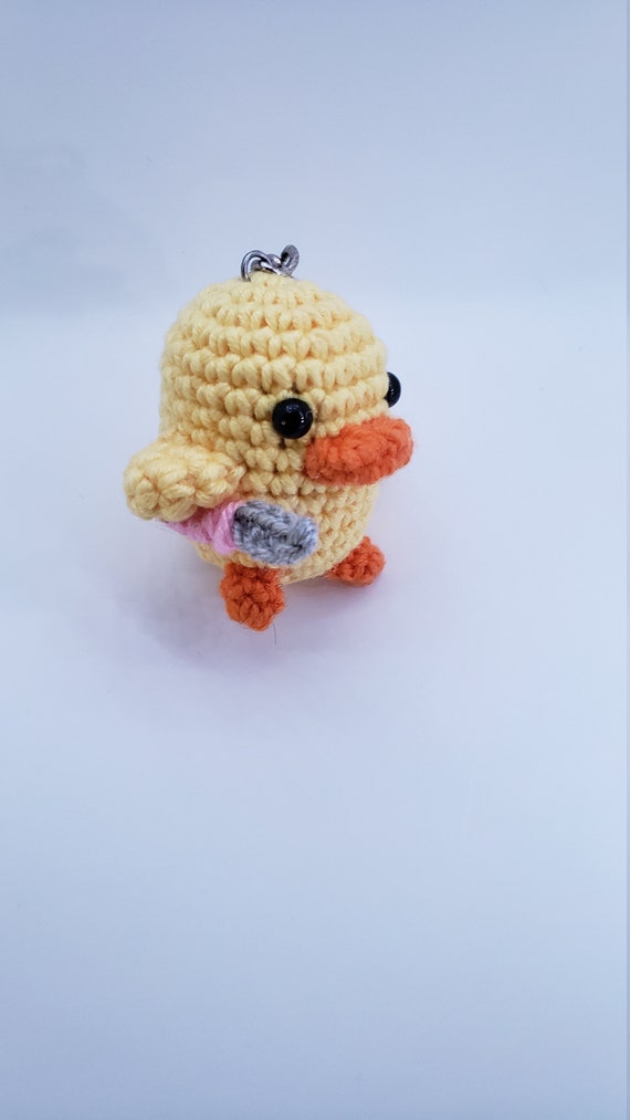 duck plushie with knife