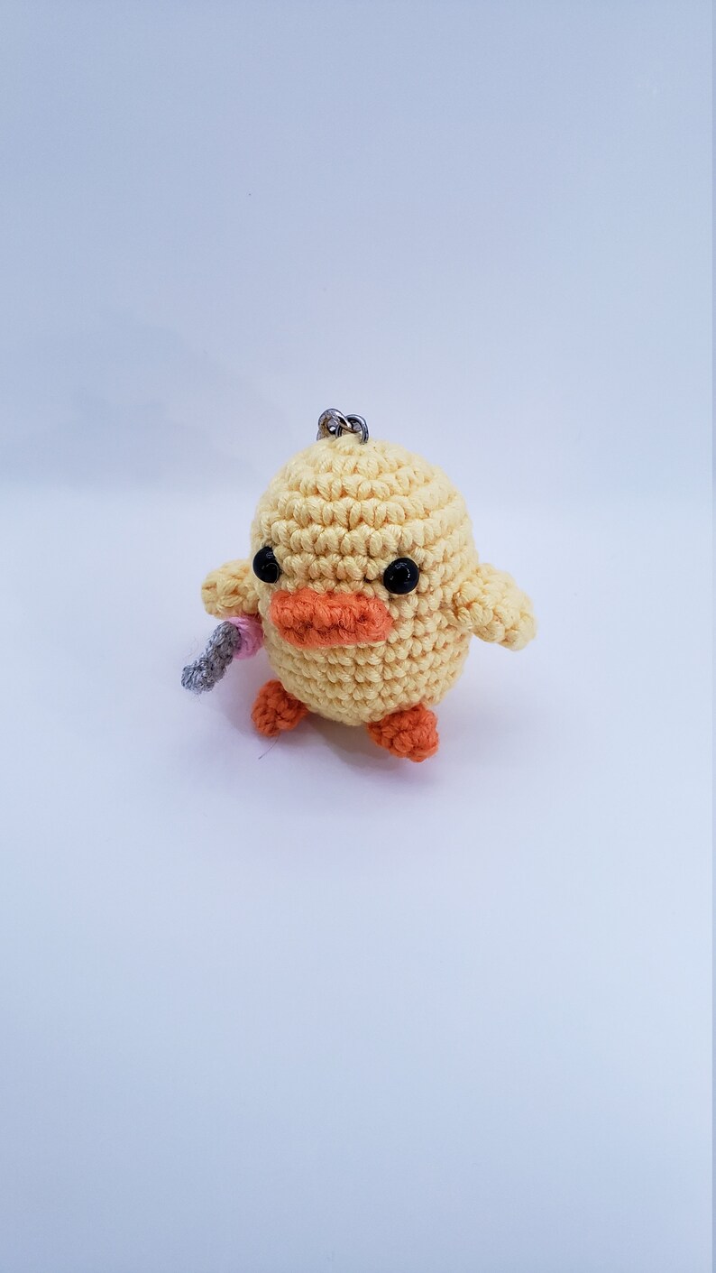 cute duck plush with knife