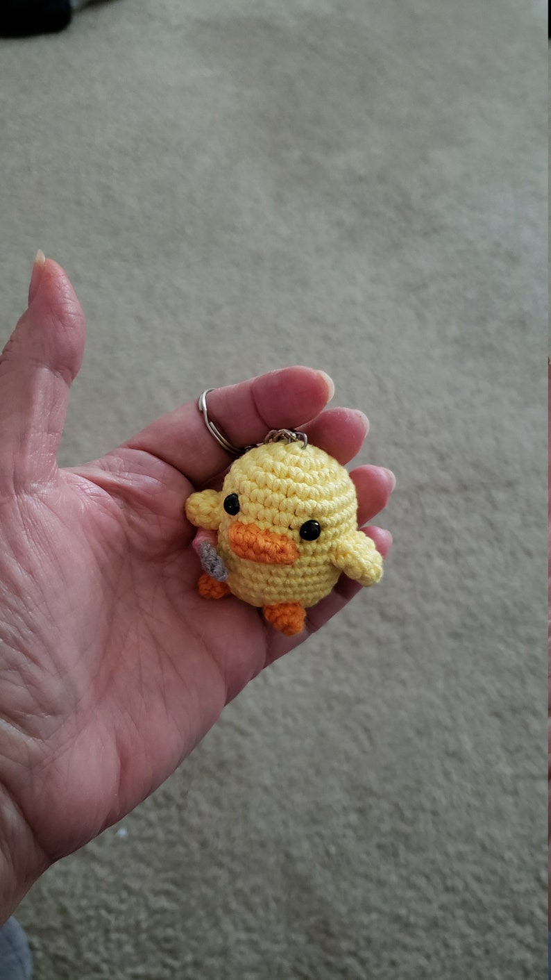 cute duck plush with knife