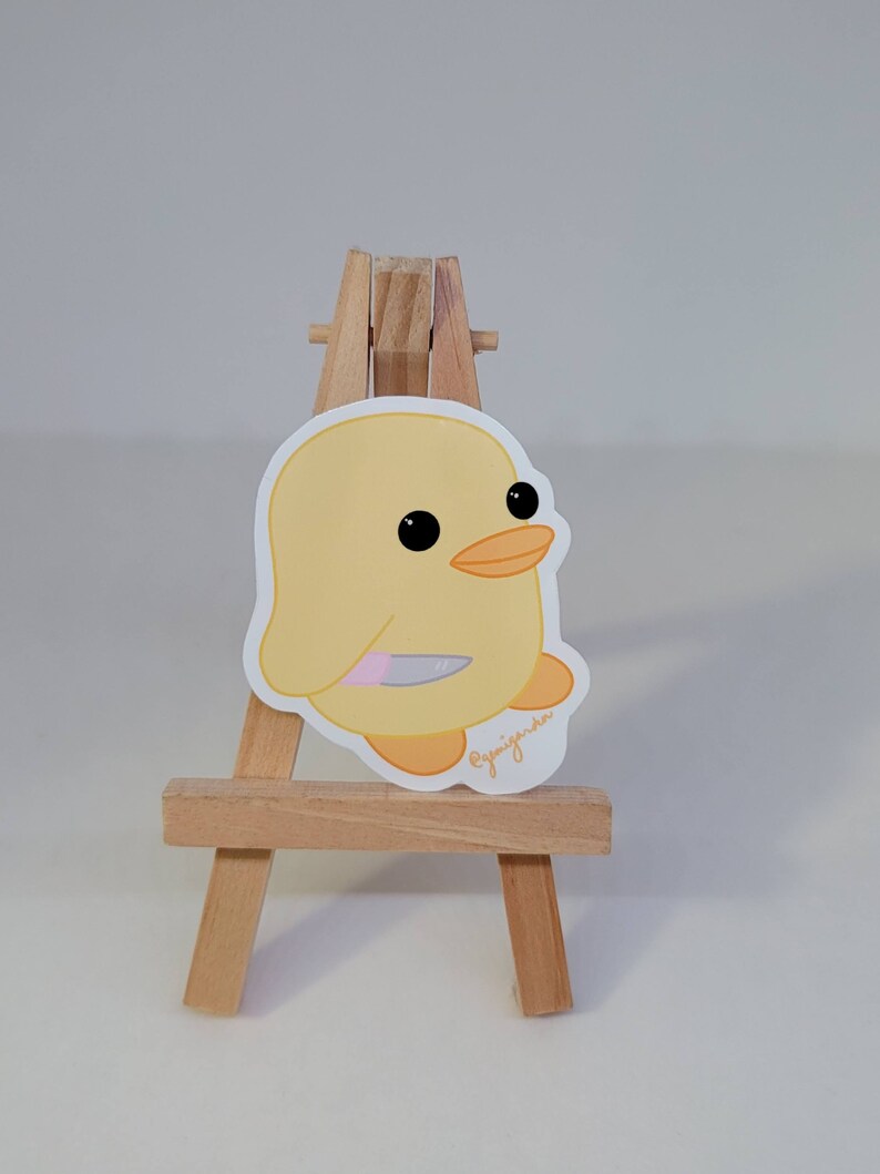 cute duck plush with knife