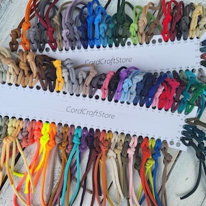 May include: A color chart of 65 different colors of cord, with each color labeled with a number. The chart is labeled "CordCraftStore".