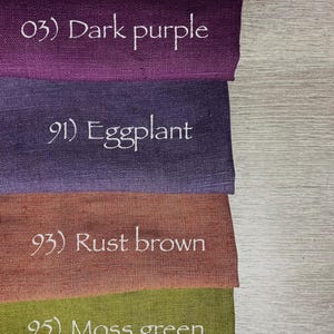 May include: Four rectangular fabric swatches stacked vertically. The top swatch is dark purple labeled 03) Dark purple. The second is eggplant labeled 91) Eggplant. The third is rust brown labeled 93) Rust brown. The bottom is moss green labeled 95) Moss green.