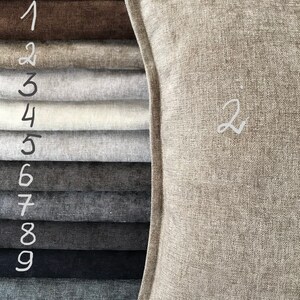 May include: Nine fabric swatches in various shades of gray, brown, and black, numbered 1 through 9. A larger swatch of a light brown fabric is labeled with the number 2.