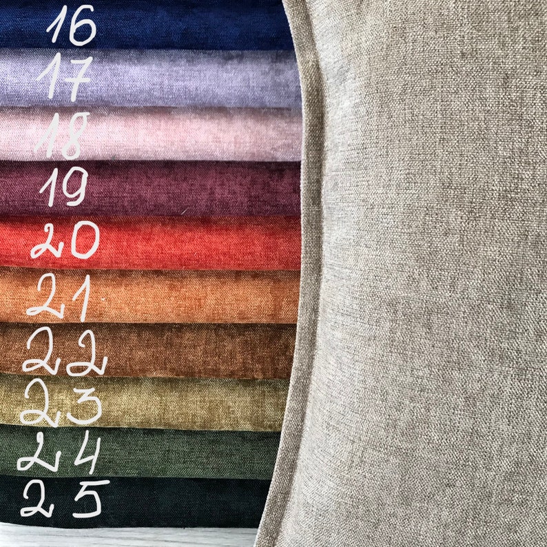 May include: A close-up of a variety of fabric swatches in different colors and textures, including navy blue, lavender, pink, burgundy, red, orange, brown, green, and black. The swatches are numbered 16 through 25.