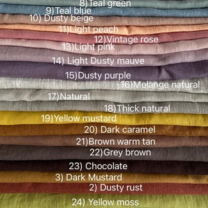 May include: A collection of folded fabric swatches in various colors labeled 6 through 26, including ivory white, light grey, teal green, teal blue, dusty beige, light peach, vintage rose, light pink, dusty mauve, purple, natural, mustard, brown, and green.