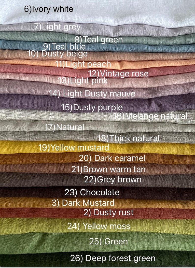 May include: A collection of folded fabric swatches in various colors labeled 6 through 26, including ivory white, light grey, teal green, teal blue, dusty beige, light peach, vintage rose, light pink, dusty mauve, purple, natural, mustard, brown, and green.