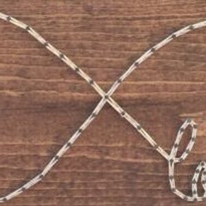 May include: A wooden sign with an infinity symbol made of nails and string. The word "love" is spelled out in the bottom loop of the infinity symbol.