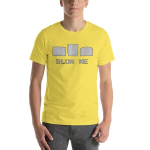 May include: A yellow t-shirt with a graphic of three video game cartridges and the text "BLOW ME".