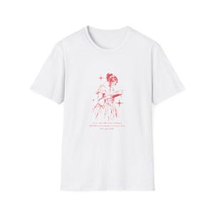 May include: White t-shirt with a red illustration of a woman reading a book. The text below the illustration reads: "every time i talk to my reading, a 200,000 word memoir to know, i have joy feels."