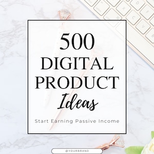 May include: A white marble background with a keyboard, a rose gold pen, and a white square with the text "500 DIGITAL PRODUCT Ideas" and "Start Earning Passive Income". The pen has a diamond-shaped top.
