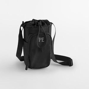 May include: Black water bottle bag with a drawstring closure and a front zippered pocket. The bag has a shoulder strap and the initials "PE" are printed on the front.