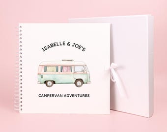 May include: A white spiral bound journal with a watercolor illustration of a vintage camper van. The journal cover reads "Isabelle & Joe's Campervan Adventures".