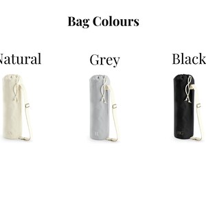 May include: Three yoga mat bags in different colors: natural, grey, and black. Each bag has a drawstring closure and a shoulder strap.