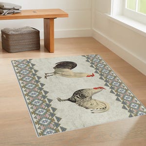 May include: A white and gray rug with a geometric pattern border and two roosters in the center. The roosters are facing opposite directions and have red combs and wattles.