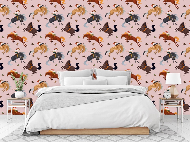 Peut inclure: Un fond rose avec un motif r&eacute;p&eacute;t&eacute; de chevaux bruns, noirs et orange avec des cavaliers. Les chevaux sautent et les cavaliers portent des chapeaux de cow-boy. Le motif est r&eacute;p&eacute;t&eacute; sur toute l'image.