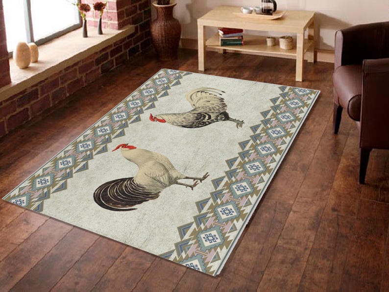 May include: A white and beige rug with a geometric pattern in shades of brown, blue, and pink. Two roosters are featured on the rug, one white and one brown, with red combs.